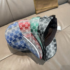 Multicolor GG monogram baseball cap with adjustable black strap and curved brim.