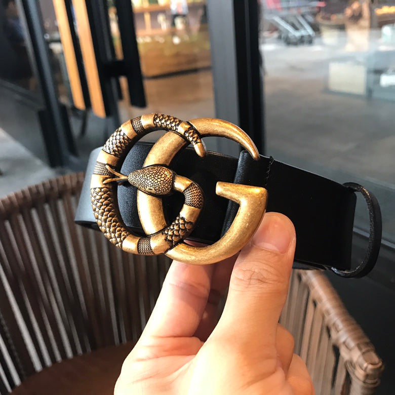 Black leather belt showing gold-tone buckle and clasp at front