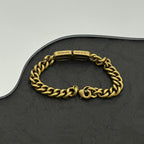 Gold-tone chain bracelet with clasp marked Balenciaga and made in Italy