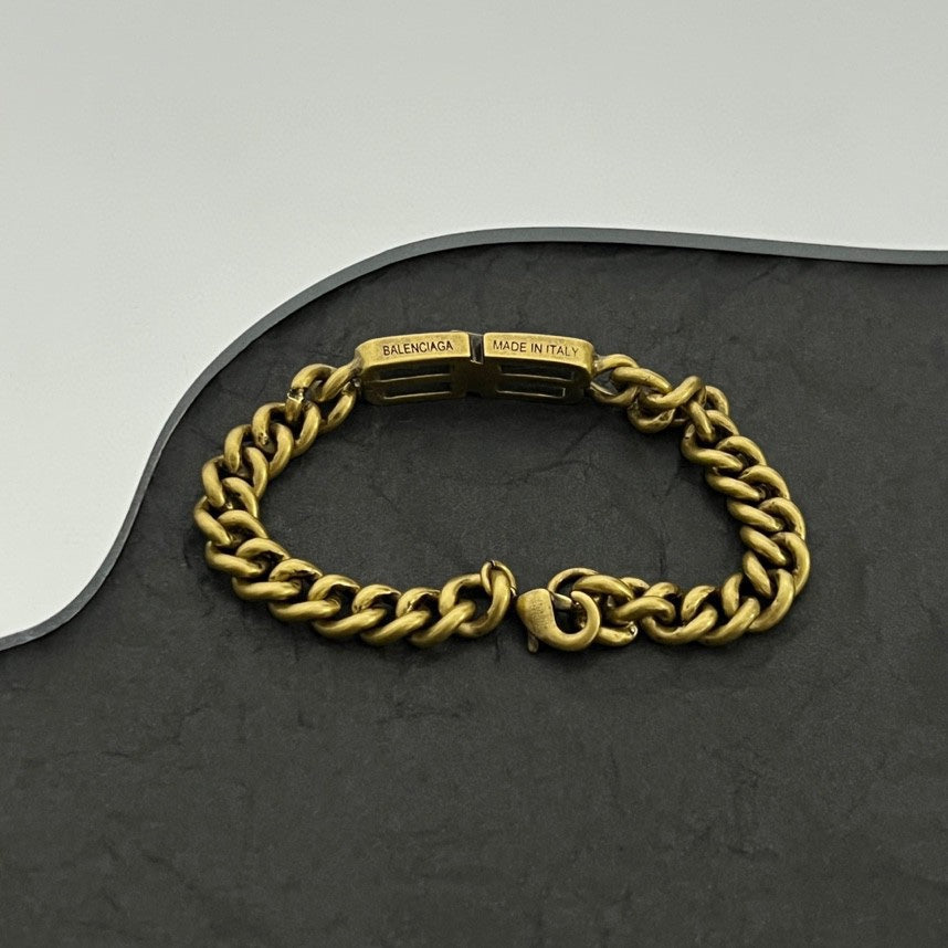 Gold-tone chain bracelet with clasp marked Balenciaga and made in Italy