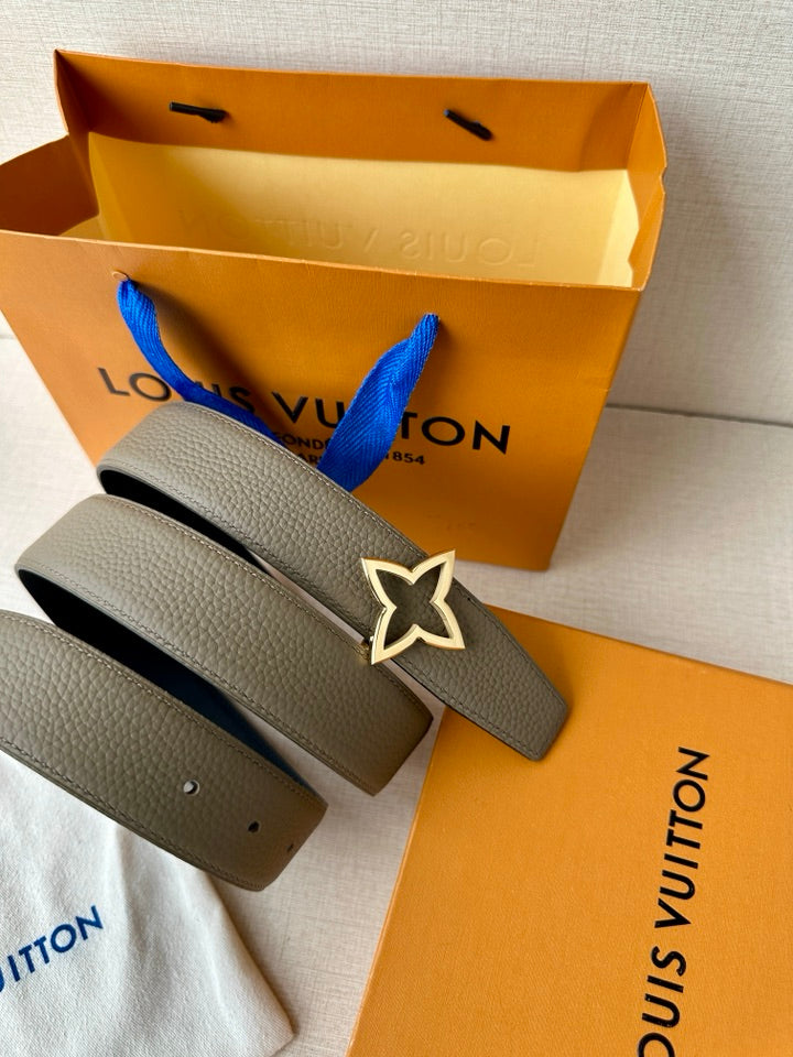 Louis Vuitton belt with light gray strap and silver star buckle, shown with belt loops