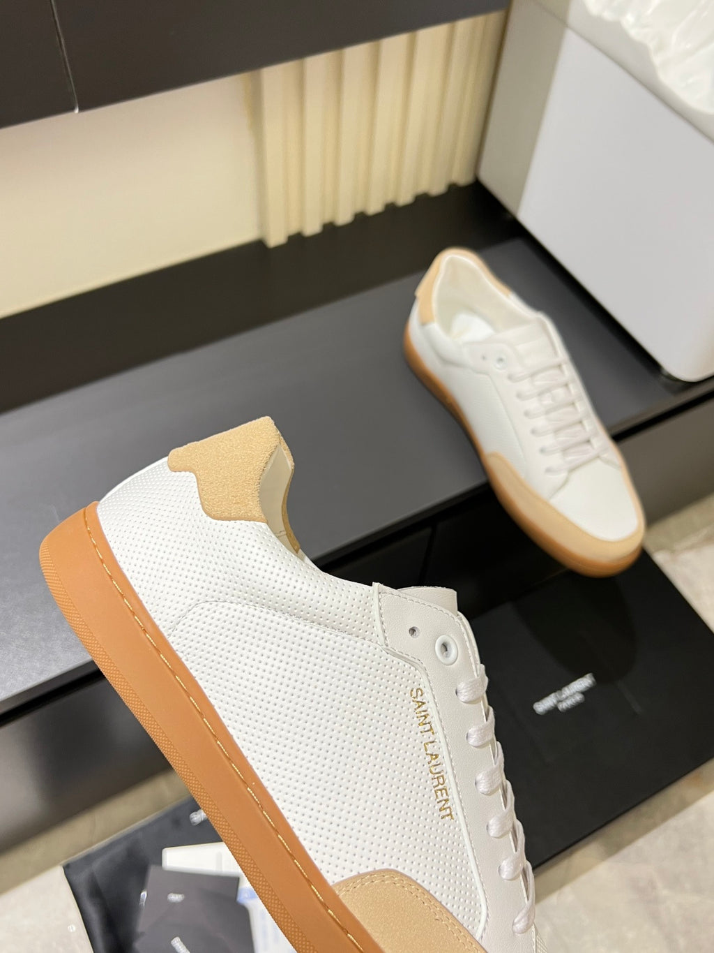 Unisex white textured sneakers with tan side panels, lace-up, gum sole