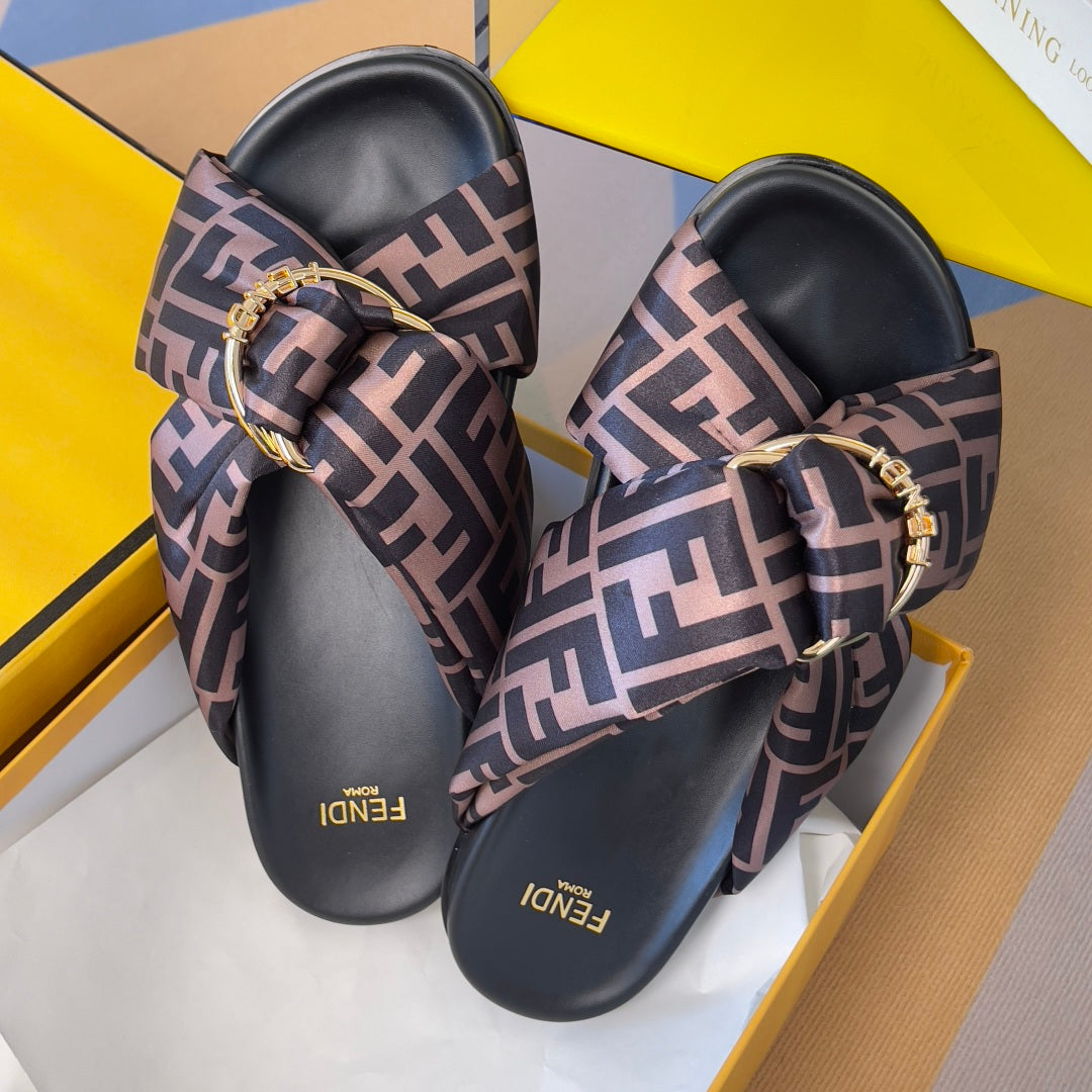 Fendi sandals with FF-print straps, black soles, gold buckle hardware, logo branding