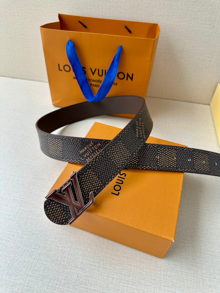 Belt with dark patterned strap and LV buckle on brown interior