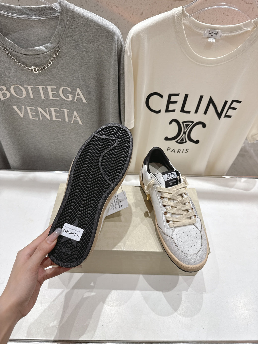 Golden Goose sneakers, white uppers with black outsole underside and lace-up front
