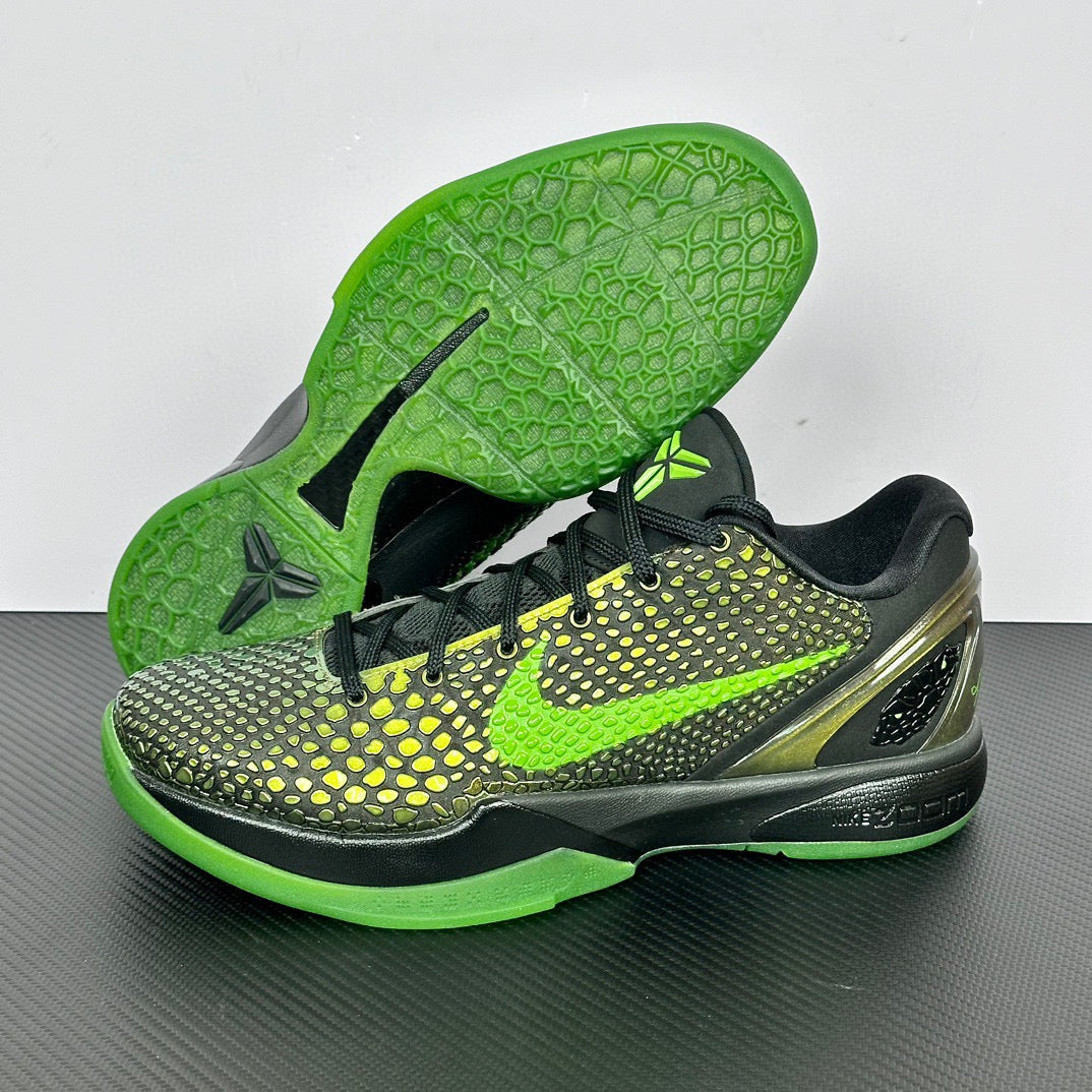 Black and green basketball shoes with lime outsole, textured upper, and neon lace detail.