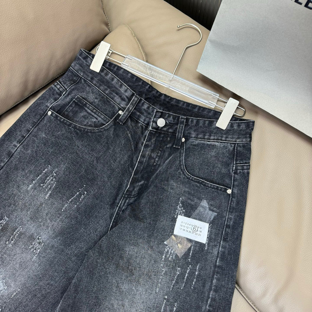 Maison Margiela dark wash denim jeans with back pockets and hanging size tag
