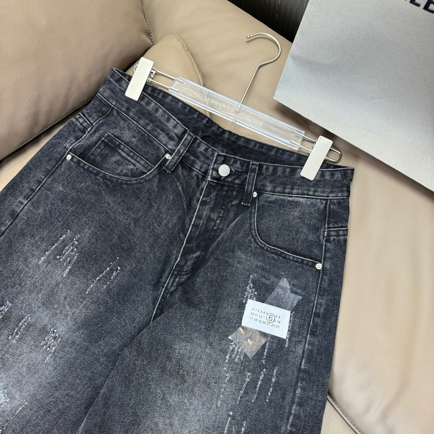 Maison Margiela dark wash denim jeans with back pockets and hanging size tag