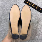 Pair of black velvet loafers with beige insoles and gold-tone logo markings