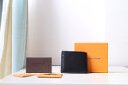Black Louis Vuitton small bag wallet with LV logo plaque on front