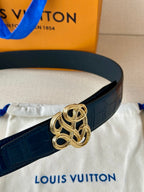 Louis Vuitton belt detail: dark blue leather with gold-tone knot buckle