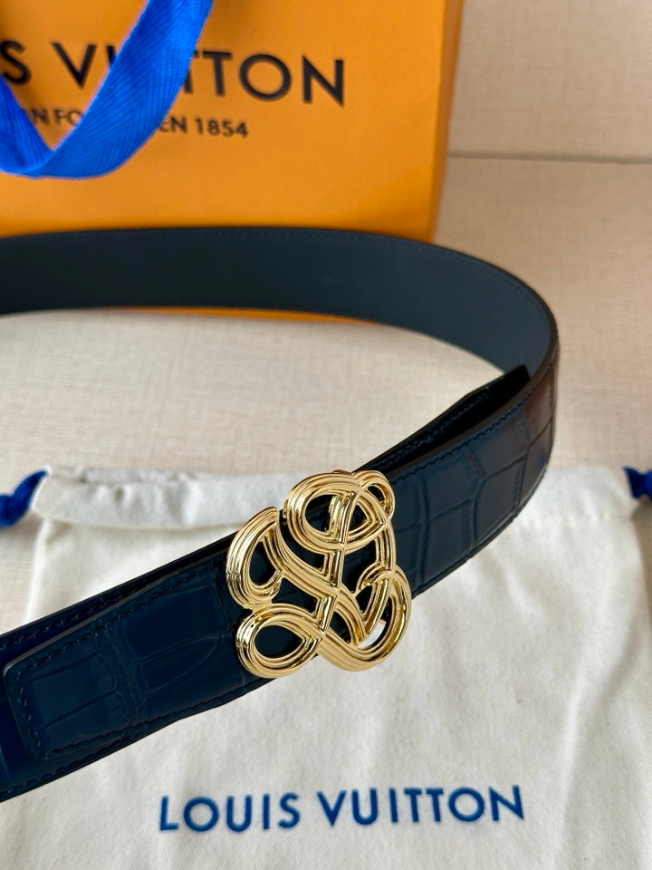 Louis Vuitton belt detail: dark blue leather with gold-tone knot buckle
