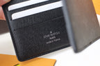 Louis Vuitton small bag, black leather card holder interior with stamped logo