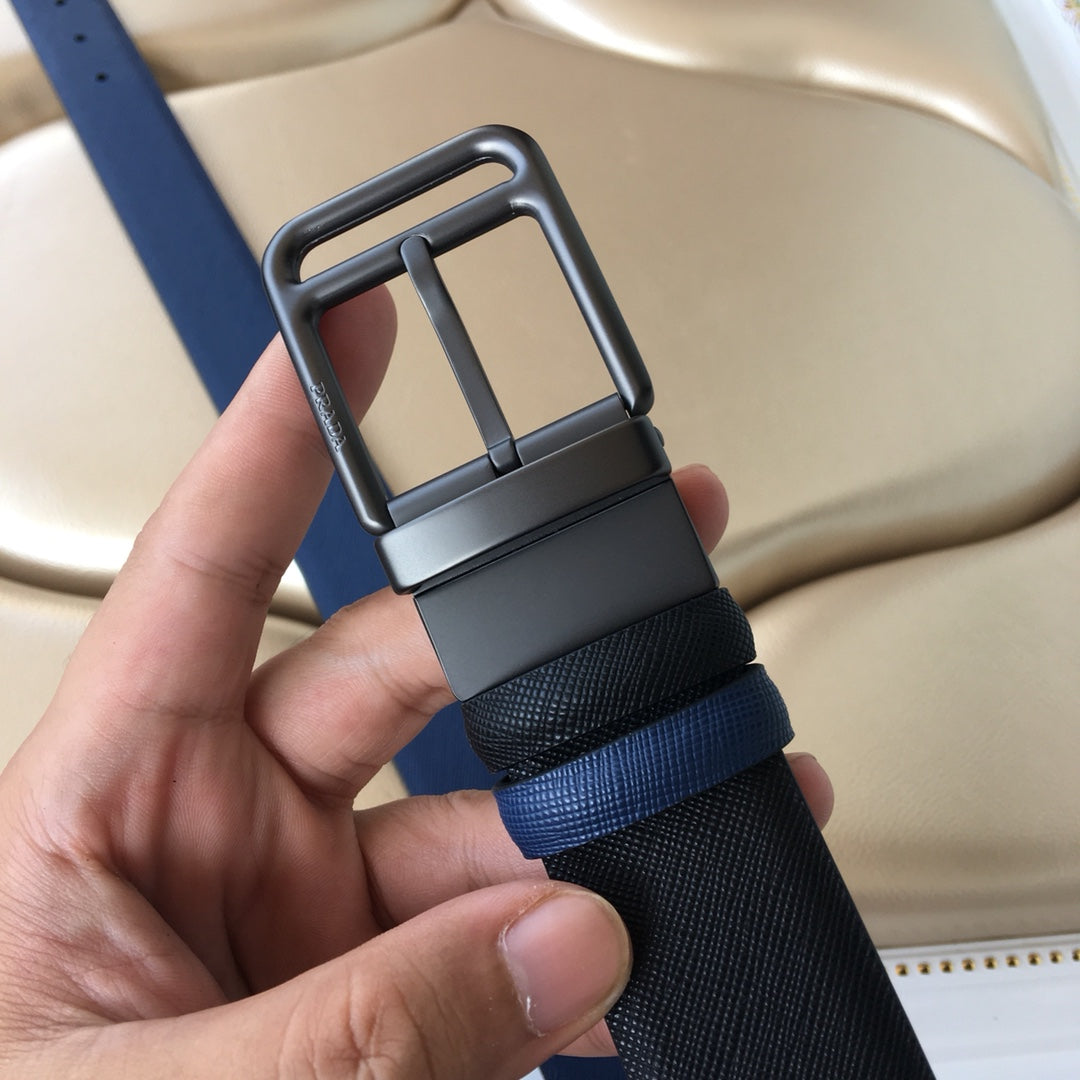 Prada belt with dark metal buckle on two-tone navy strap