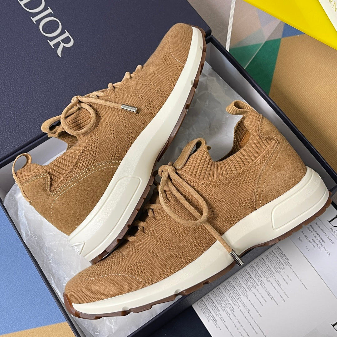 Tan unisex knit sneakers with lace-up ties, padded collar, and white cushioned sole