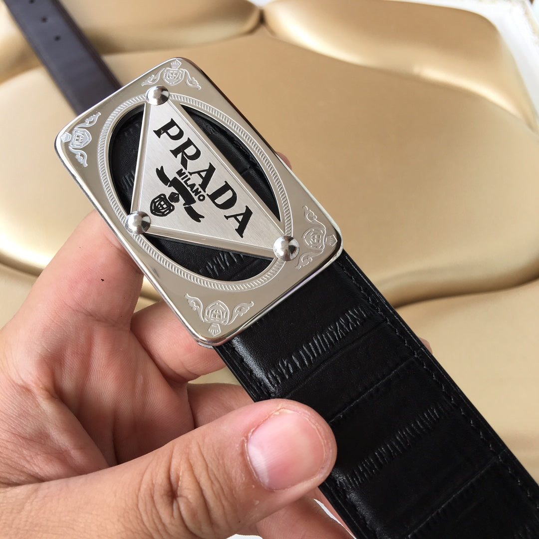 Prada belt with dark leather strap and silver PRADA logo buckle, metal rivets