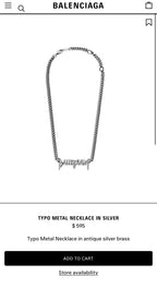 Silver metal necklace with elongated Balenciaga logo charm on a fine chain