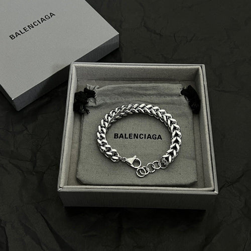 Silver chain bracelet in gift box with BALENCIAGA logo engraving and black tassel accents