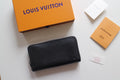 Louis Vuitton small zip bag in black textured leather with silver zipper