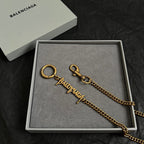 Balenciaga gold logo keychain necklace with ring and clasp, in gift box
