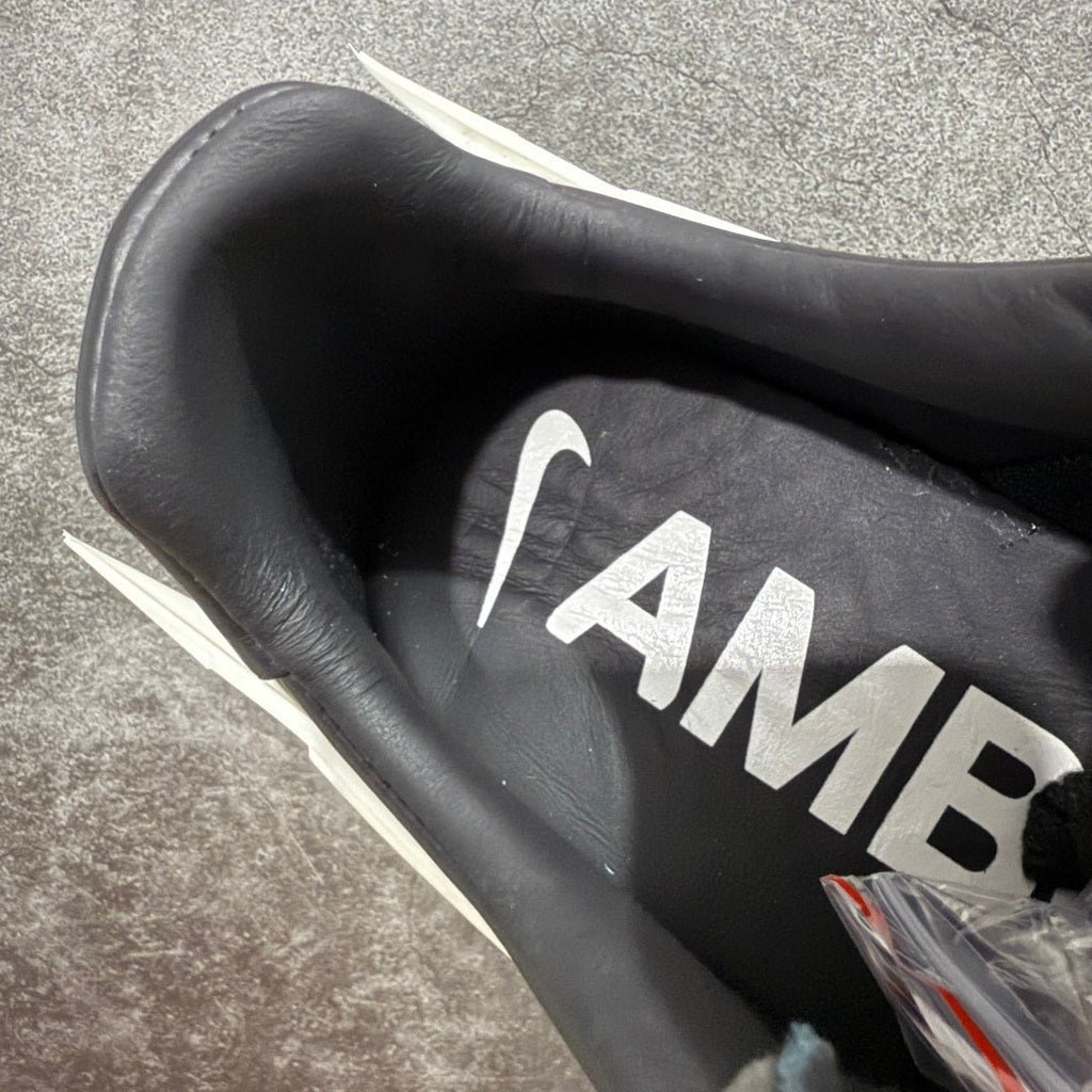 Black interior lining with large white AMBUSH lettering on the insole