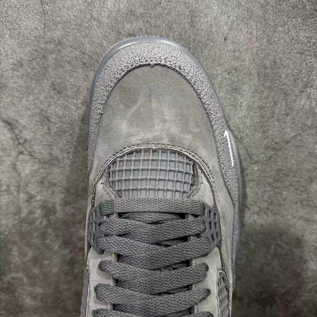Gray suede sneaker toe with textured mesh underlay and lace-up front