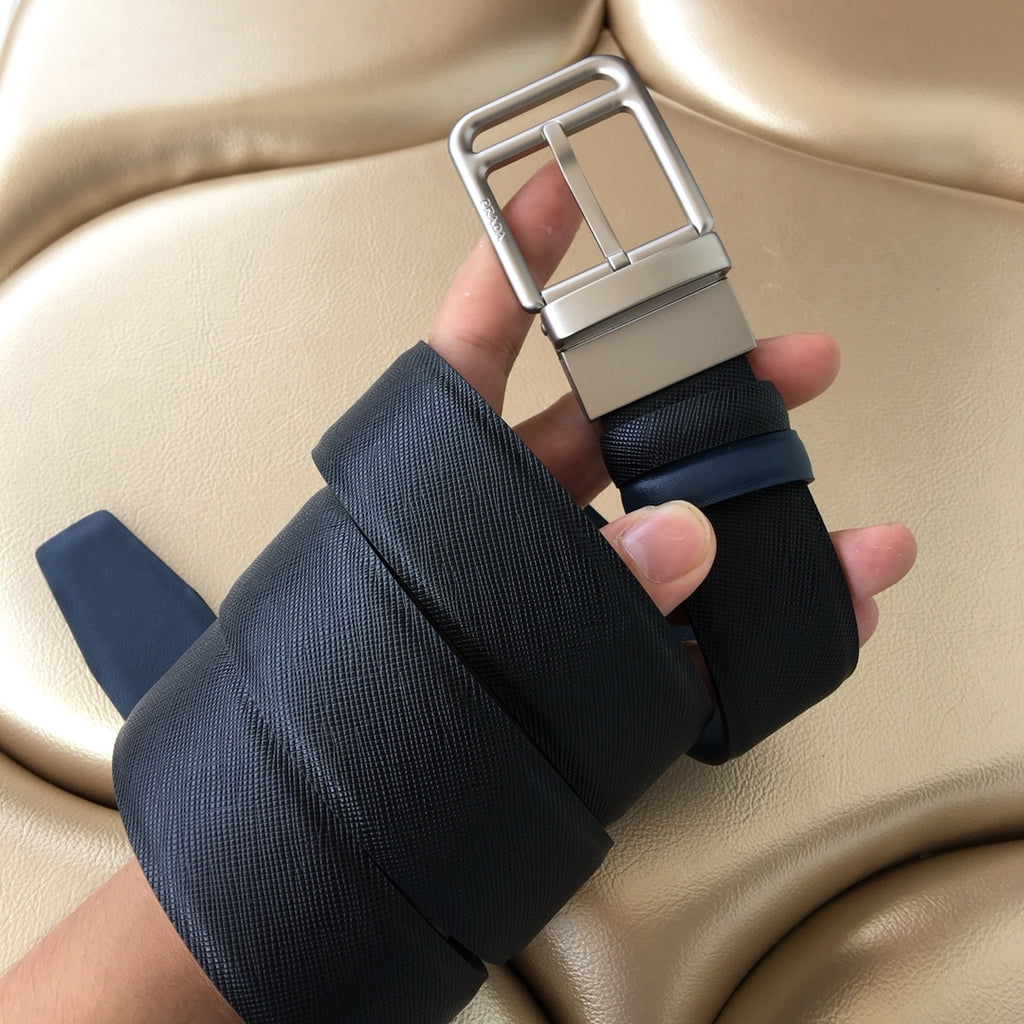 Dark blue belt with silver buckle and layered keeper strap
