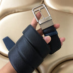 Dark blue belt with silver buckle and layered keeper strap