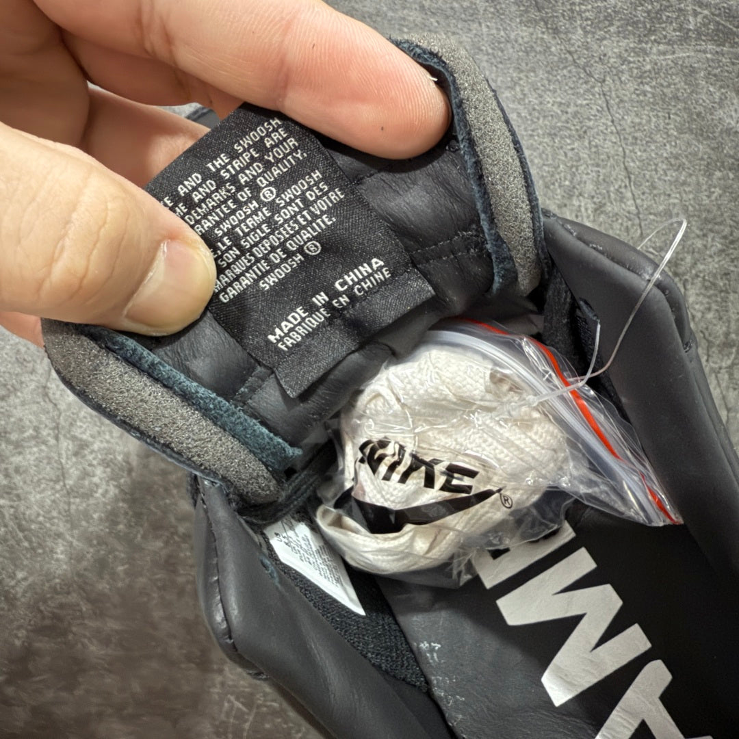 Black sneaker tongue lining with printed interior label and lace opening