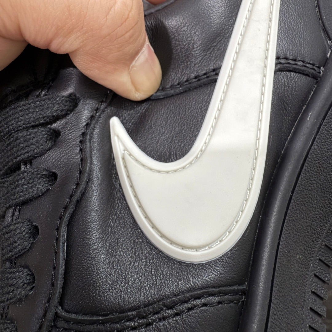 Black leather sneaker with white Nike Swoosh on side panel