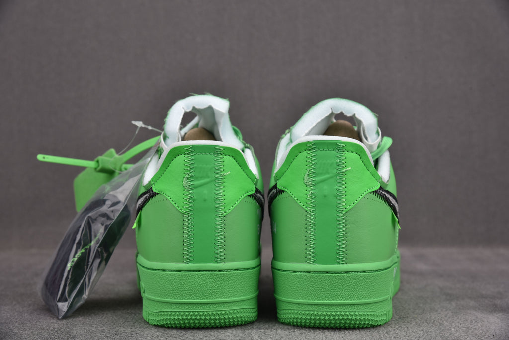 Pair of low-top Air Force 1 sneakers in bright green with white accents