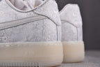 Light gray low-top sneaker heel with cream rubber sole and rear panel