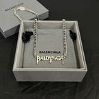 Balenciaga logo necklace with silver-tone chain and dangling charm in gift box