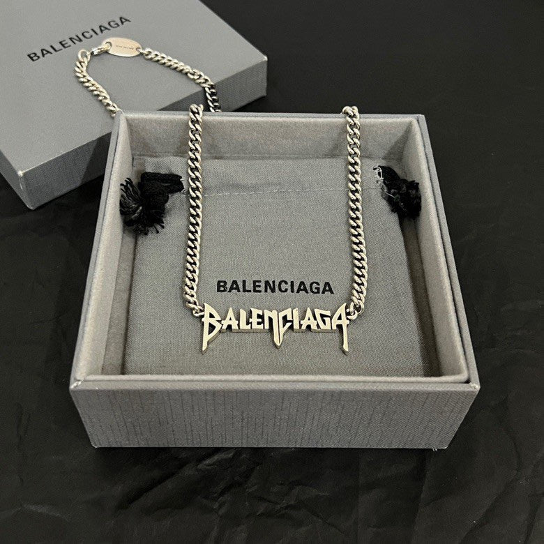 Balenciaga logo necklace with silver-tone chain and dangling charm in gift box