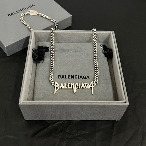Balenciaga logo necklace with silver-tone chain and dangling charm in gift box