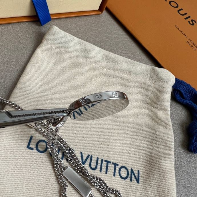 Louis Vuitton white pouch with silver chain hardware and blue drawstring