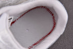 Sneaker interior lining with red stitched edge and gray footbed