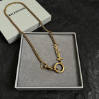 Balenciaga gold logo necklace with ring clasp and curb chain in gift box