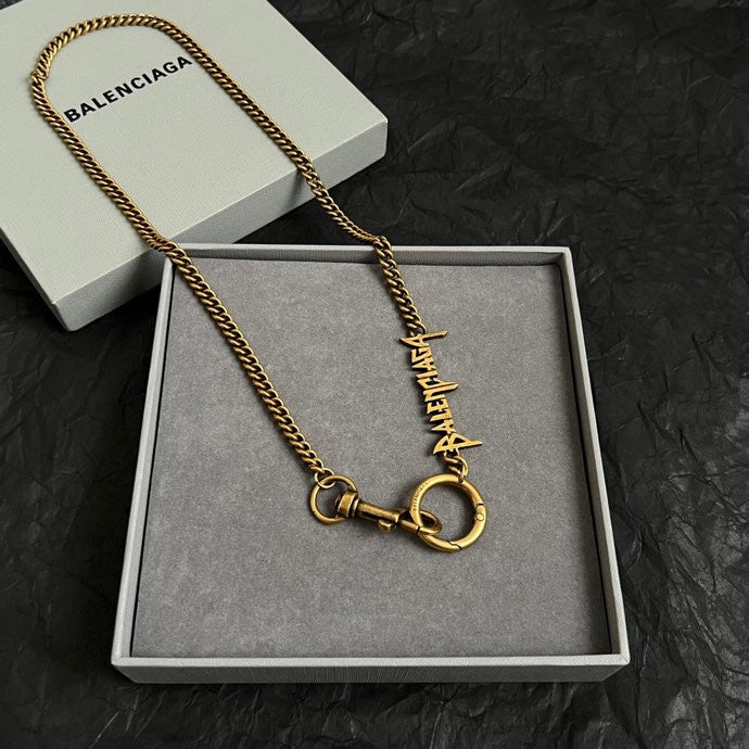 Balenciaga gold logo necklace with ring clasp and curb chain in gift box