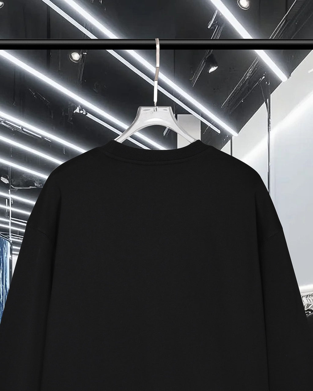 Black long-sleeve crewneck sweatshirt, rear view