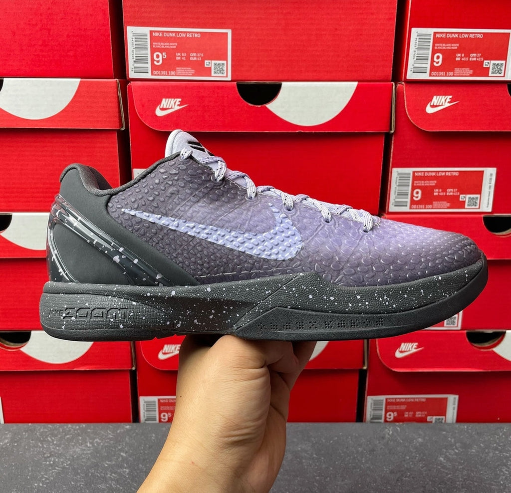Basketball sneaker with dark gray and purple upper, lace-up front, black sole.