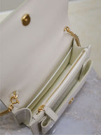 YSL bag, open white interior with gold chain detail and zip pocket