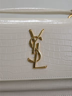 YSL bag flap, white croc-texture leather with gold YSL monogram hardware