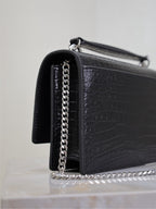 YSL croc-embossed shoulder bag with chain strap and metal top handle, black.