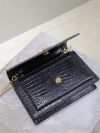 Navy croc-textured wallet bag with gold-tone logo button and chain strap.