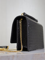 Black croc-textured shoulder bag side view with front flap and gold-tone chain strap.