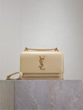 YSL small flap bag in cream with gold-tone chain strap and YSL logo front
