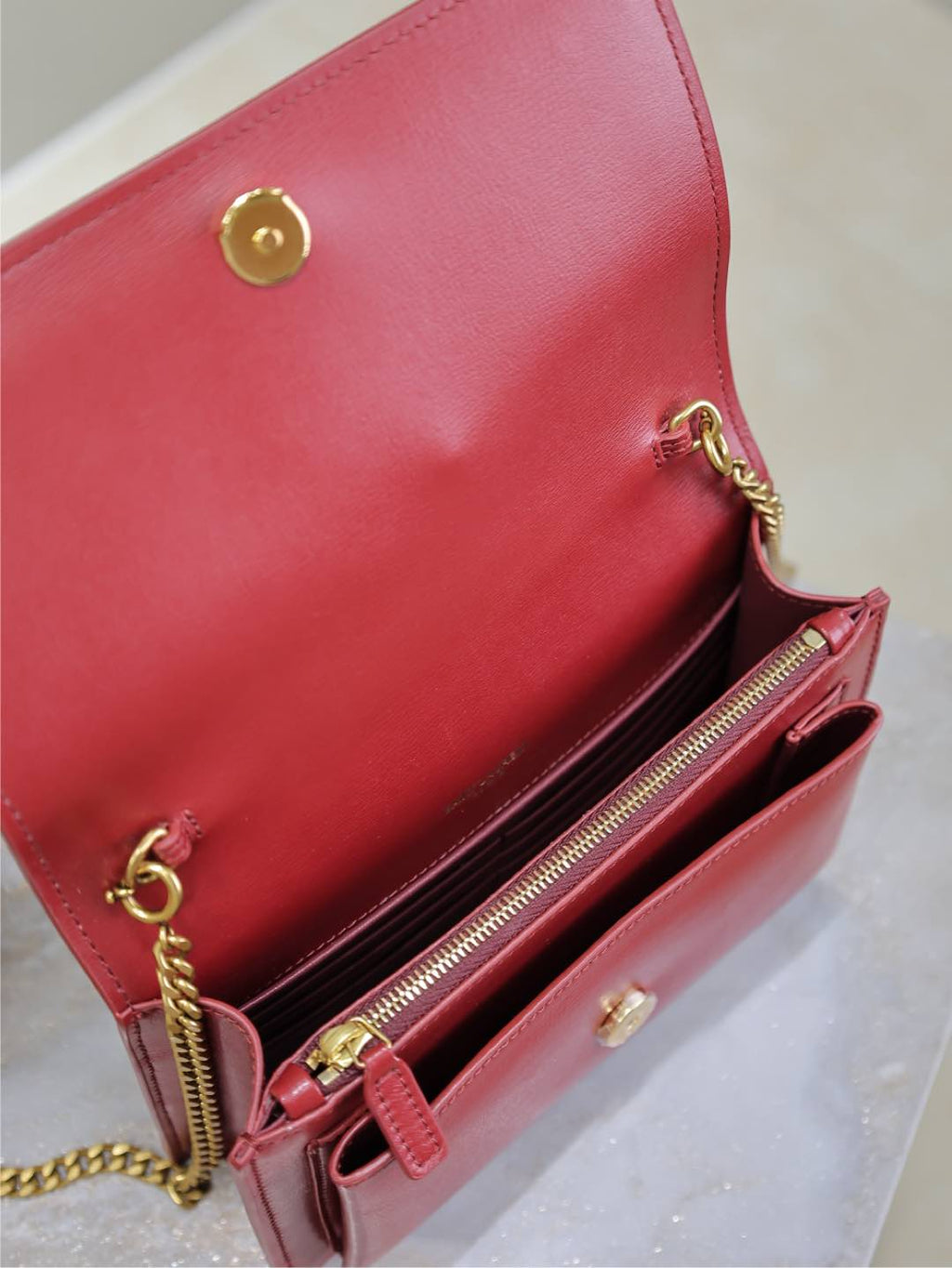 YSL red leather shoulder bag interior with gold zipper and chain