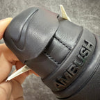 Black sneaker heel with embossed "AMBUSH" lettering