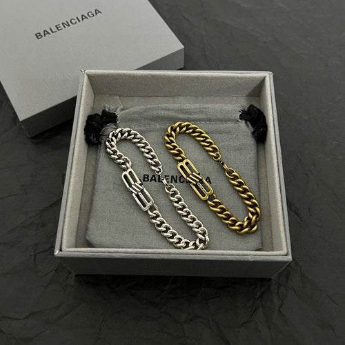Chain bracelet set in box: silver-tone and gold-tone link bracelets with tassel pull cords
